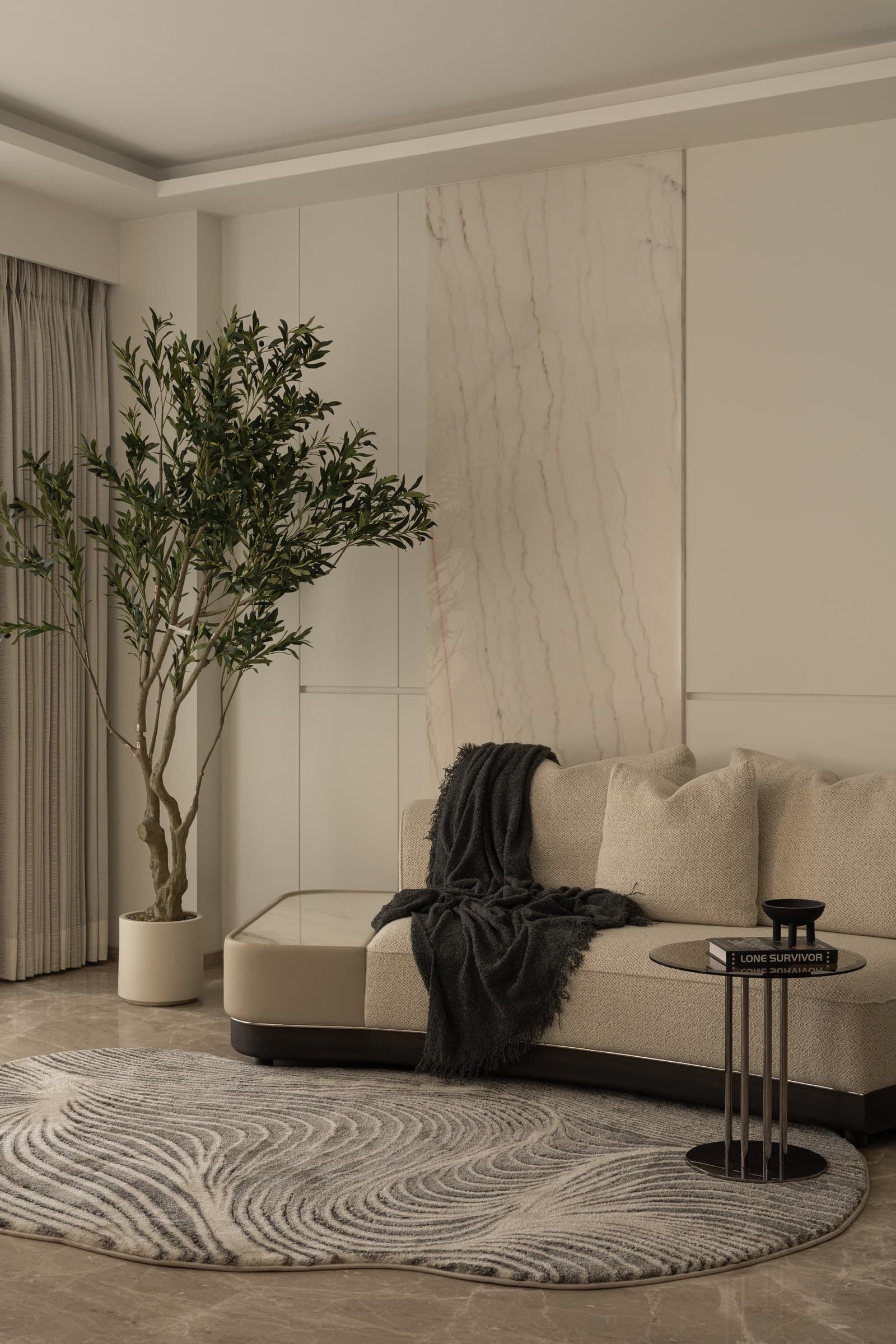 A warm, styled living room furnished by The Decora